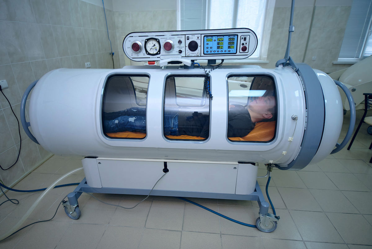 Hyperbaric chambers make the player breathe pure oxygen to speed up healing.
